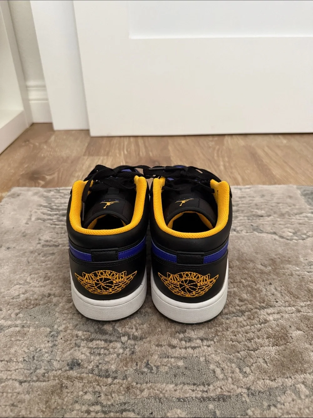Jordan 1 Low-Top Sneakers in Black, Royal Blue & Yellow